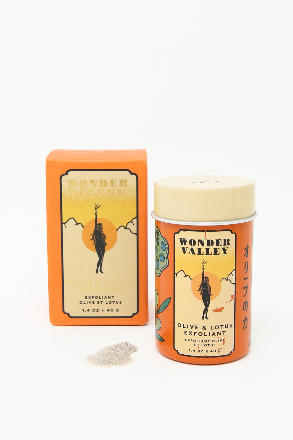 A Wonder Valley Olive & Lotus Exfoliant tin with a box next to it for facial exfoliation using botanical powders.