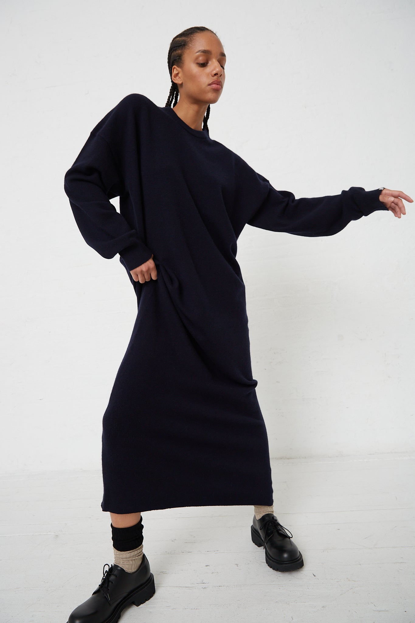The model is wearing a No. 106 Weird Dress in Navy made of Extreme Cashmere blend fabric.