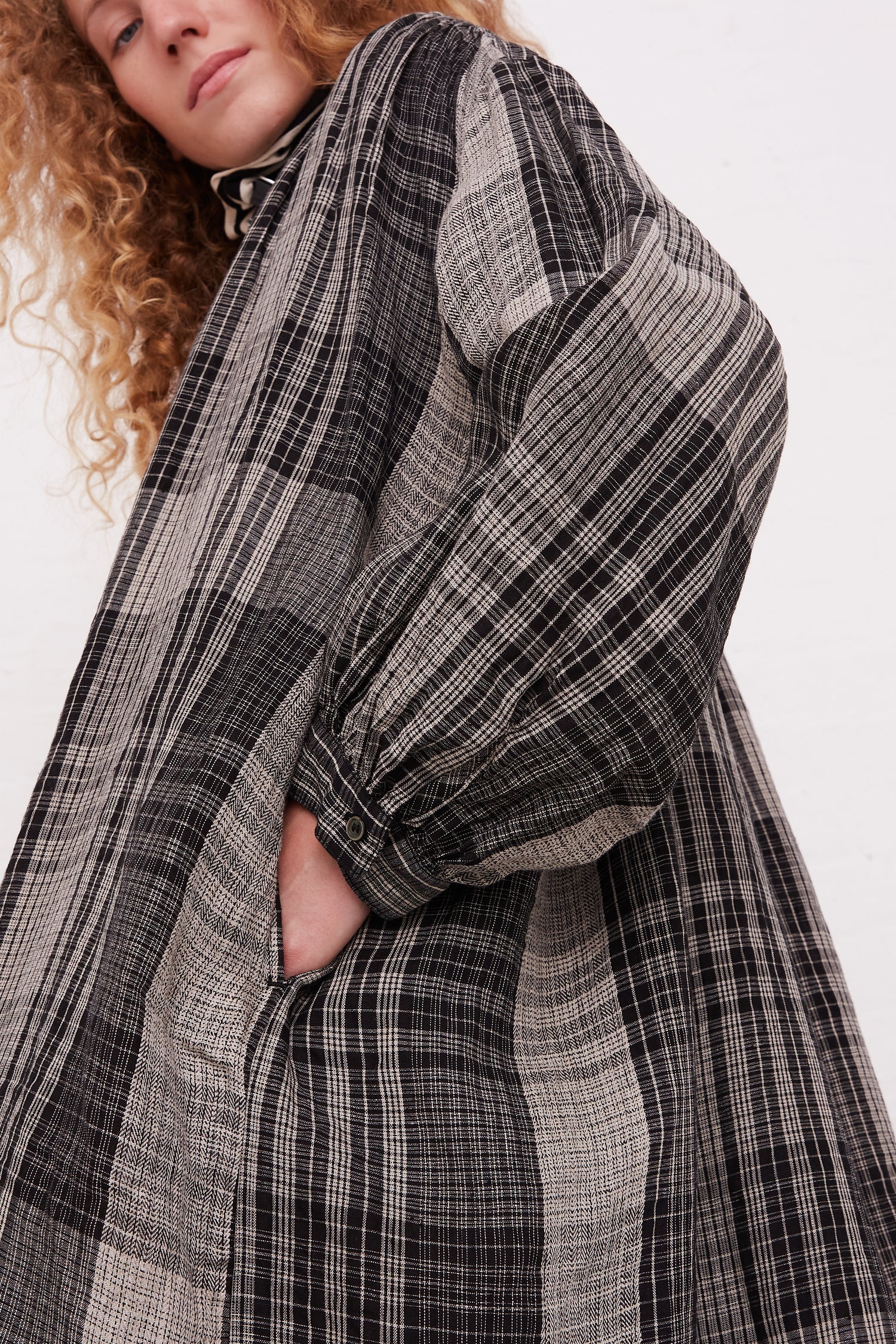 A model wearing a Linen Big Check Dress in Black by Ichi Antiquités, available at Oroboro store in NYC.