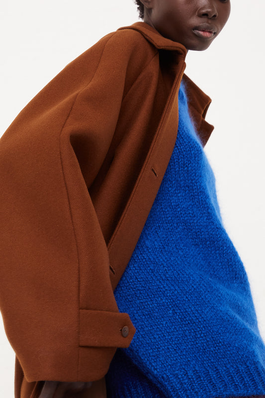 CORDERA Wool Coat Camel | Oroboro Store | Side image of coat upclose opened on model