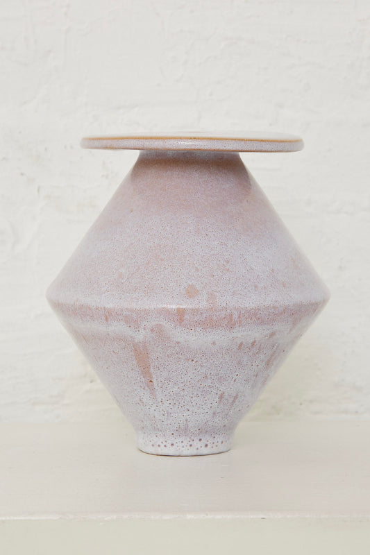 A Large Diamond Vase in Pink Ice by BZIPPY, handmade in Los Angeles by artist Bari Zipperstein, on a white table.