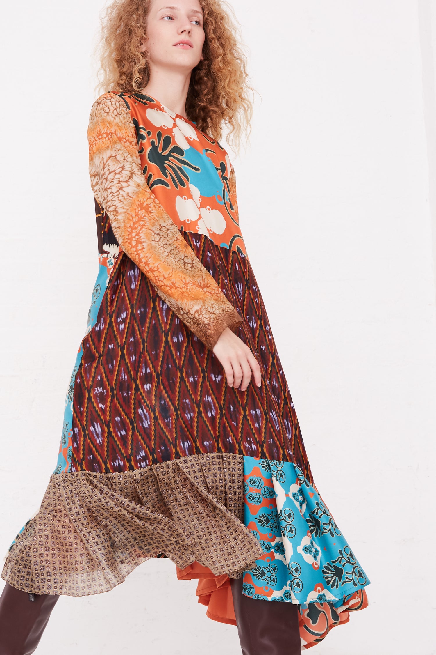 A woman in a Bettina Bakdal Silk Vintage Scarves Lena Hannah Dress - M.