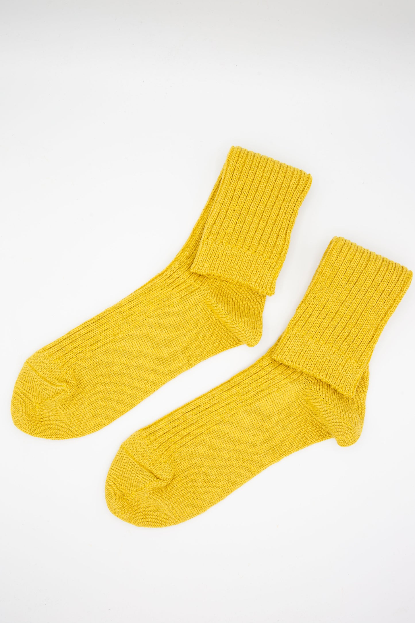 A pair of Ichi Antiquités Linen Rib Sock in Yellow ankle socks on a white background.