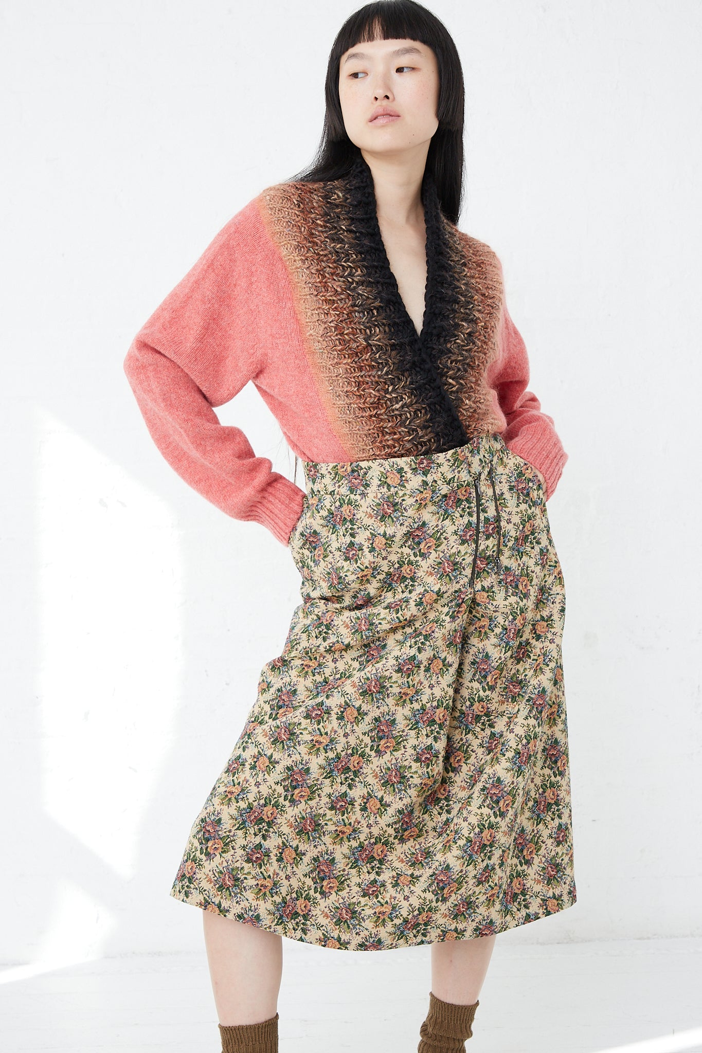 A woman wearing a SMLXL Skirt No. 75 in Flower from the luxury lifestyle brand Bless.