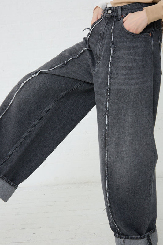 A close up of a pair of MM6 5 Pockets Pant in Grey. Side view.