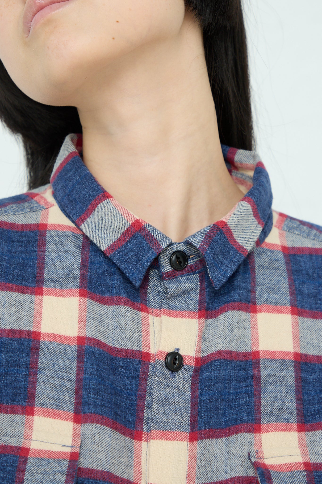 A woman wearing an Ichi Woven Cotton Shirt in Ivory and Navy. Up close.