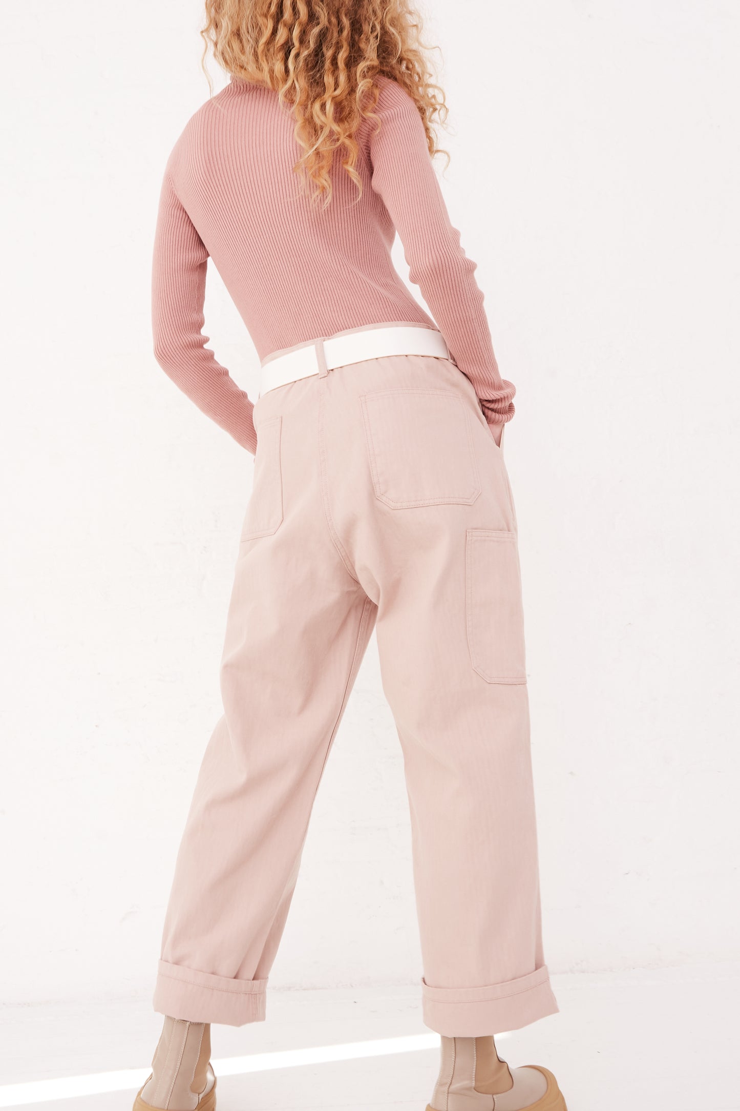 The back of a model wearing Ichi Antiquités Herringbone Pants in Pink, available at Oroboro store in NYC.