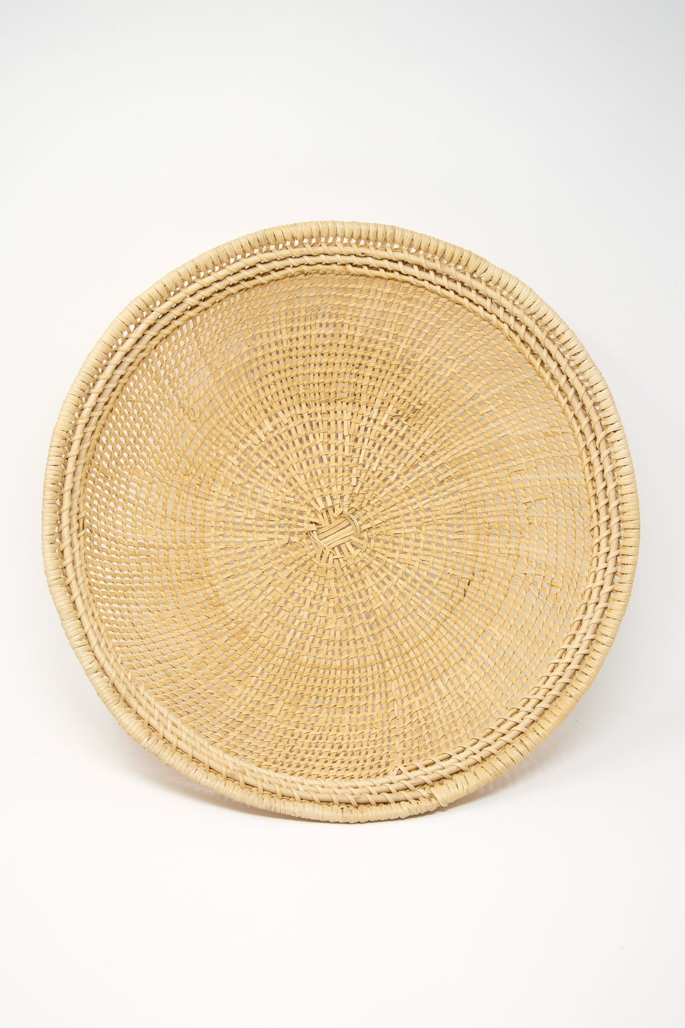 An artisan-crafted Large Avia Pova Basket by Plaza Bolivar on a white background.