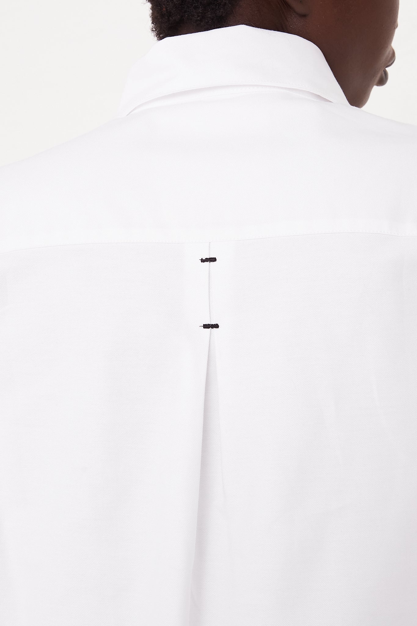 CORDERA Long Sleeve Shirt in White | Oroboro Store | Back view upclose showing back detail on model