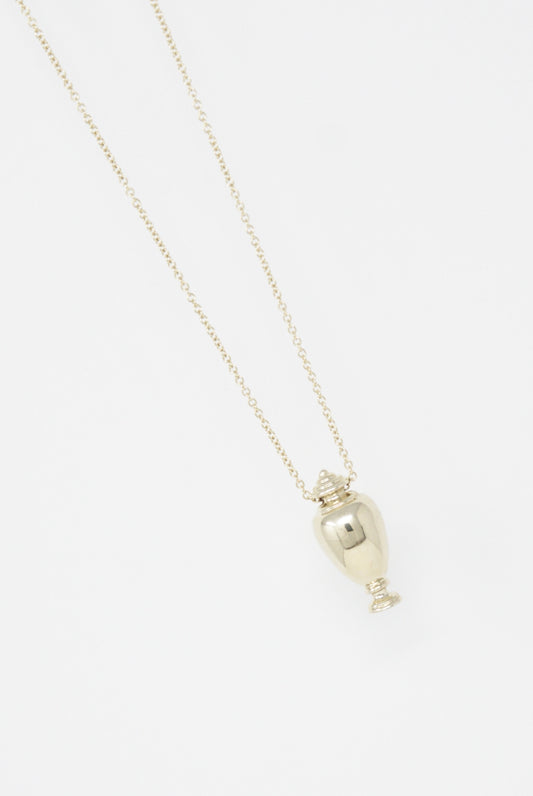 A 14K yellow gold necklace with a small Urn pendant, handmade in Los Angeles by Kathryn Bentley.