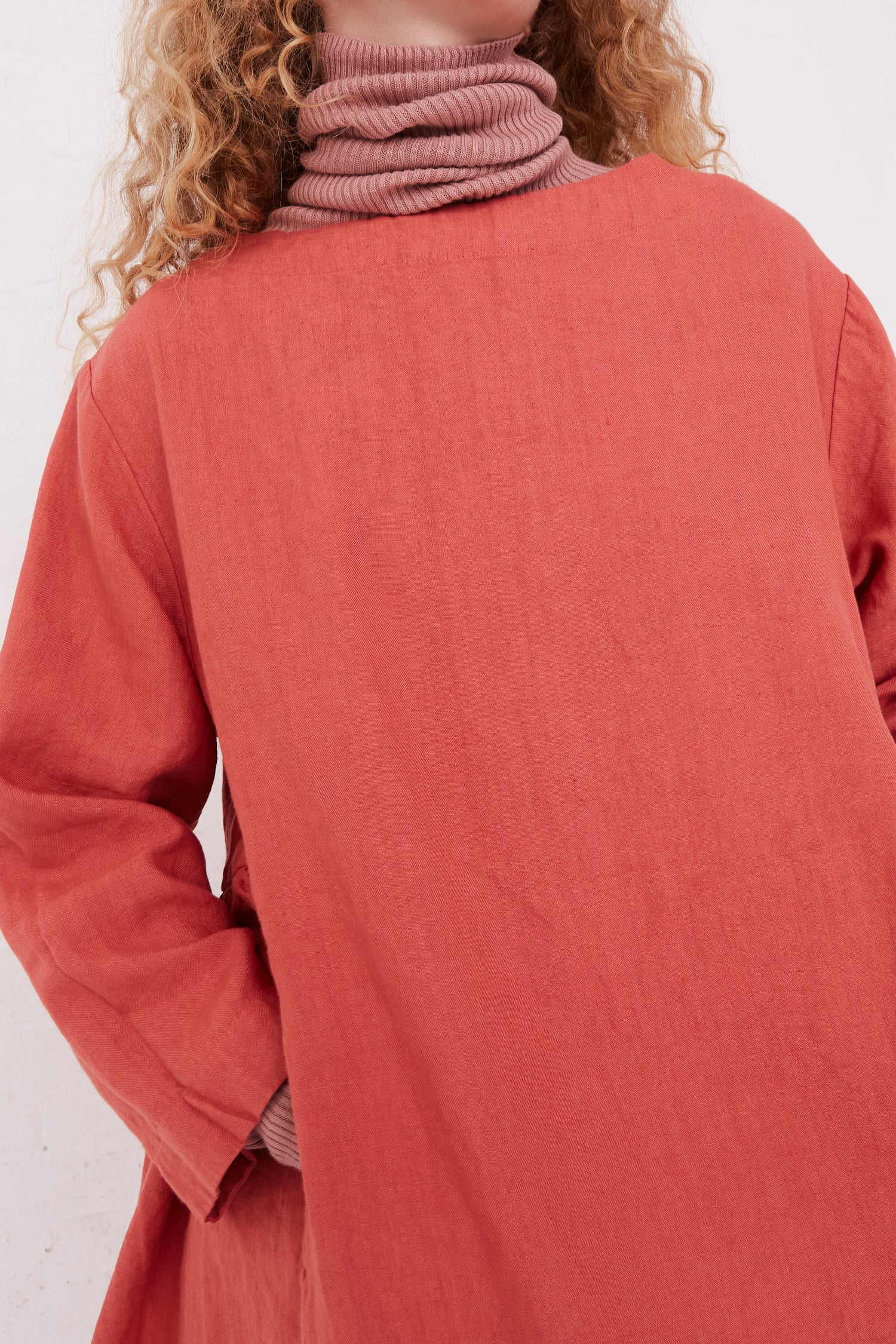 A woman wearing a relaxed fit Kortrijk Linen Dress in Pink by Ichi Antiquités.