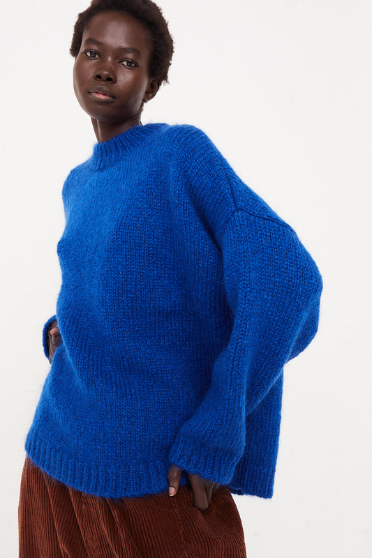 CORDERA Mohair Sweater in Blue | Oroboro Store | Front view of sweater upclose on model