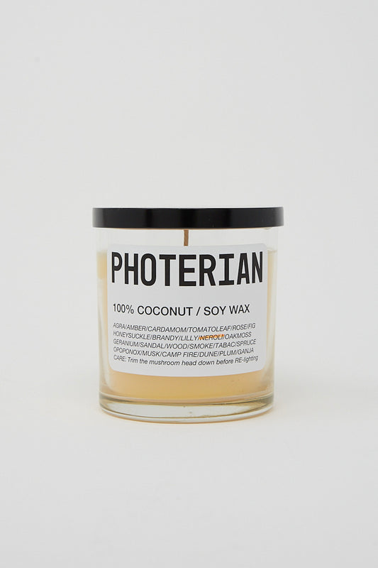 A Votive Coconut Soy Candle in Neroli Orange Blossom Flower by Photerian in a jar.
