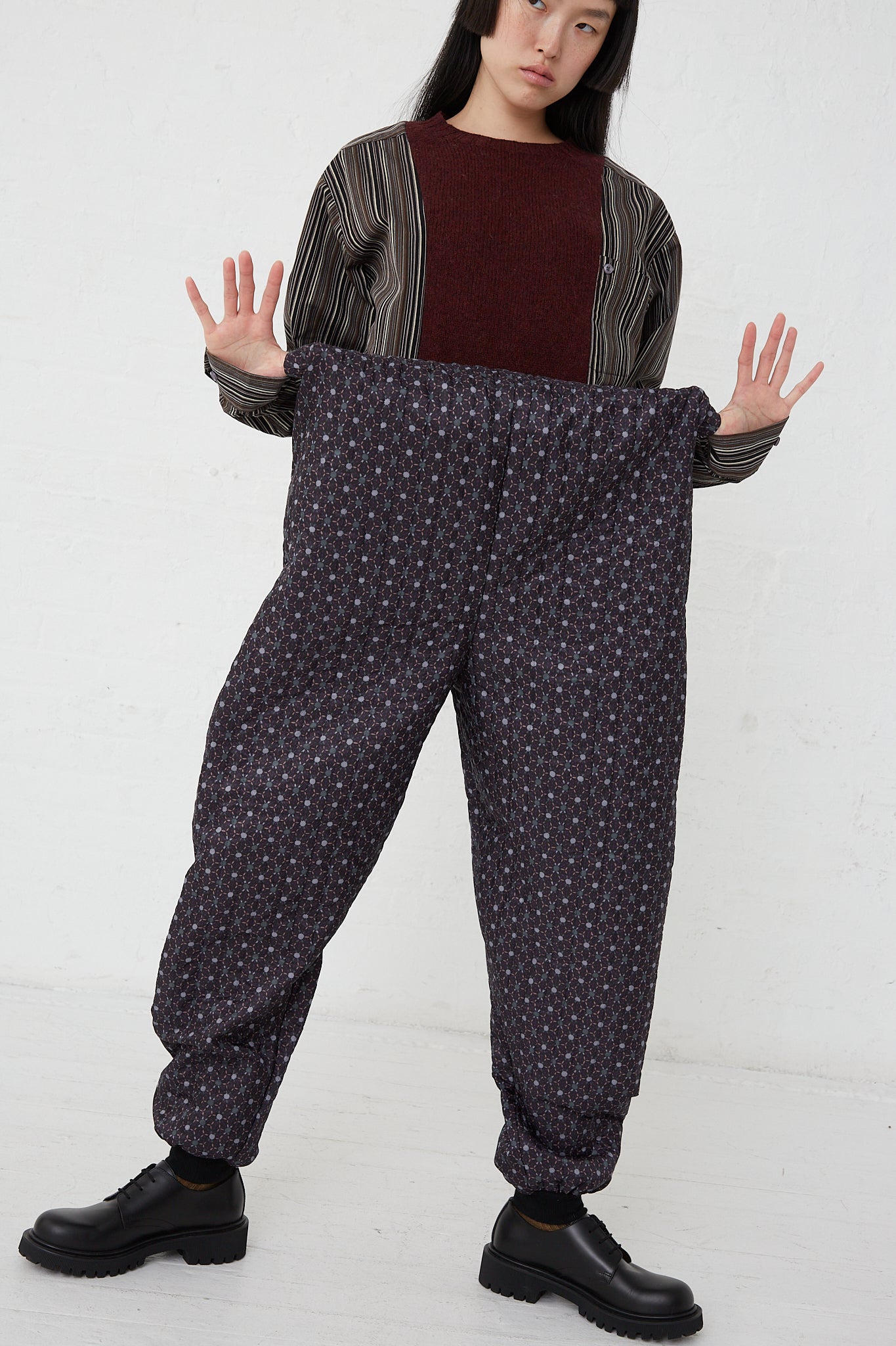 A woman wearing Monpe Pant No. 08 in Floral Print A - L by Bless with an elasticated waist.