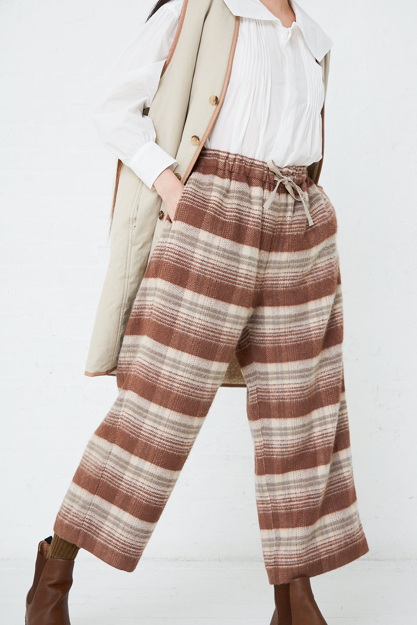 The model is wearing Silk Plaid Mosser Cloth Pajama Pants in Cocoa Brown by Toujours.