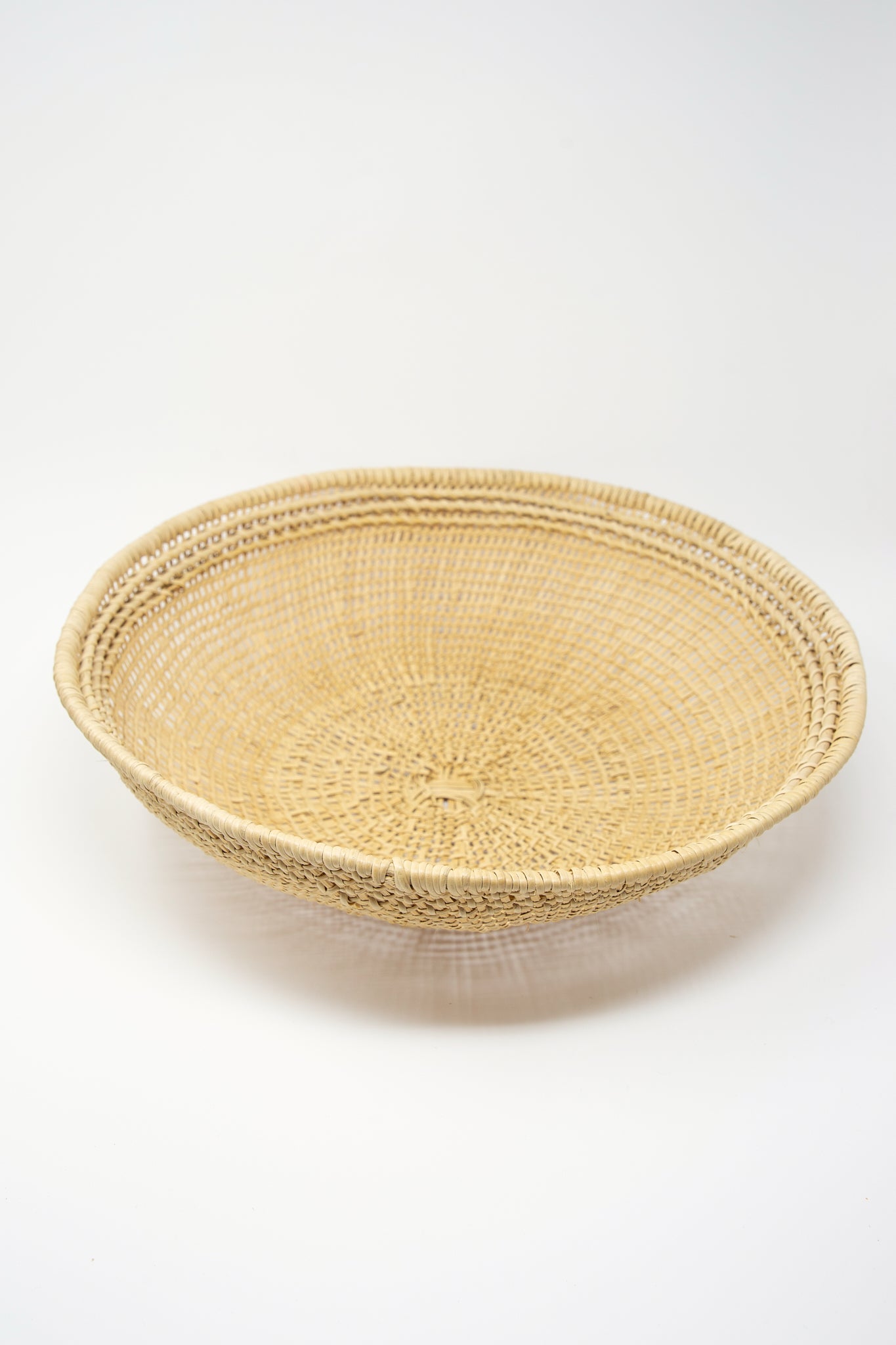 An artisan-crafted Large Avia Pova Basket woven with intricate weaving techniques, displayed on a clean white background. (Brand: Plaza Bolivar)