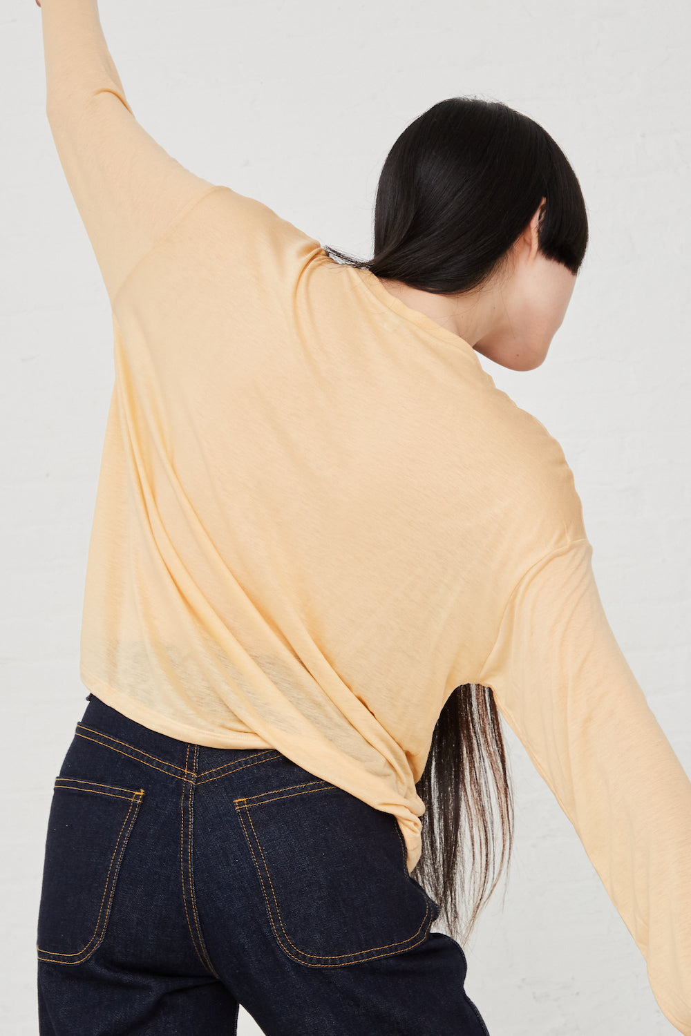 Baserange - Loose Long Sleeve Tee in Daf Yellow back view on model.
