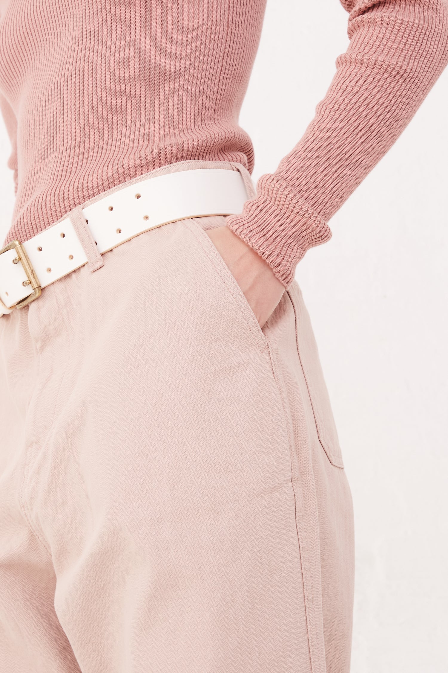 A model wearing Herringbone Pants in Pink by Ichi Antiquités.