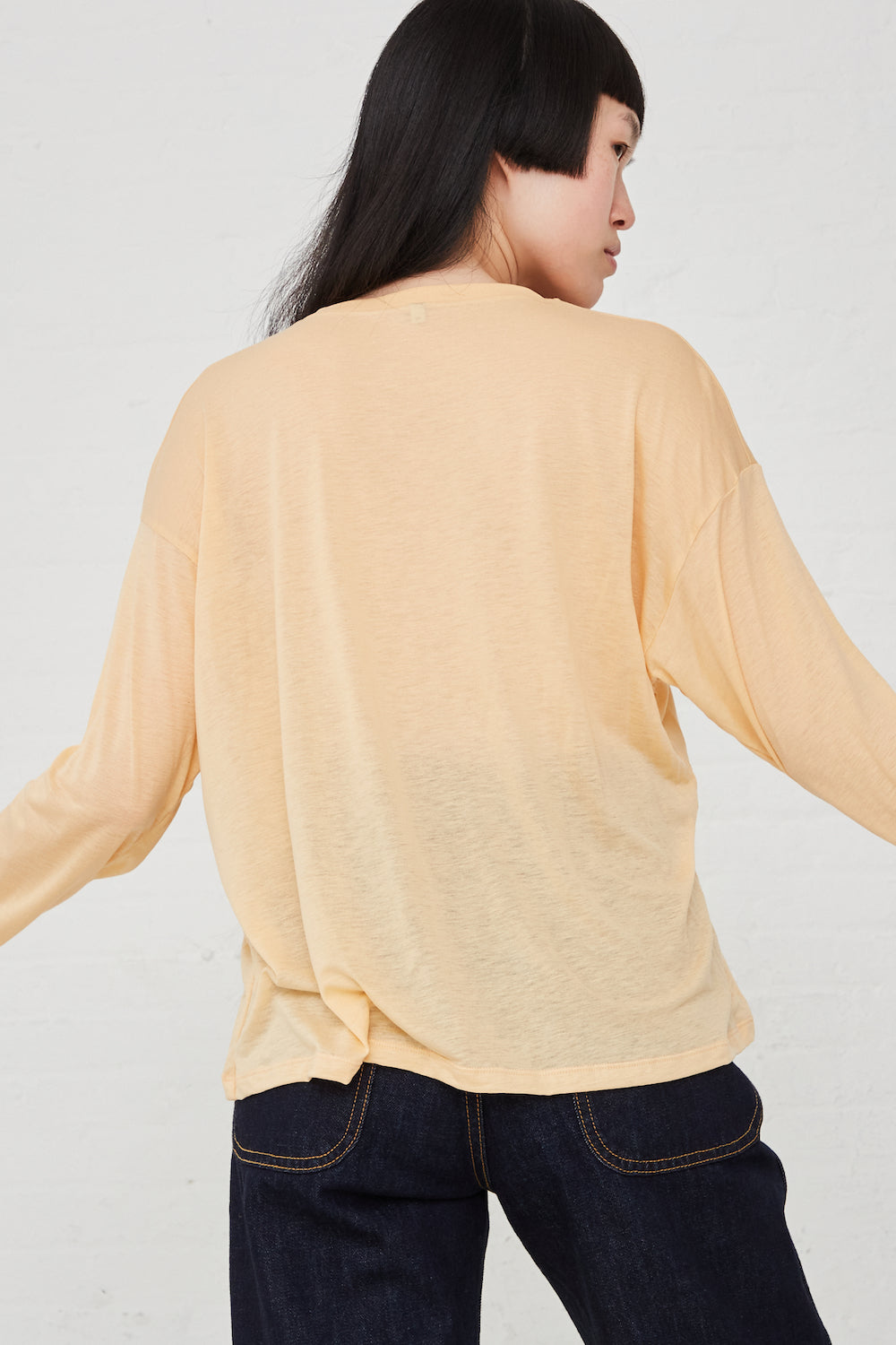 Baserange - Loose Long Sleeve Tee in Daf Yellow full front view on model.