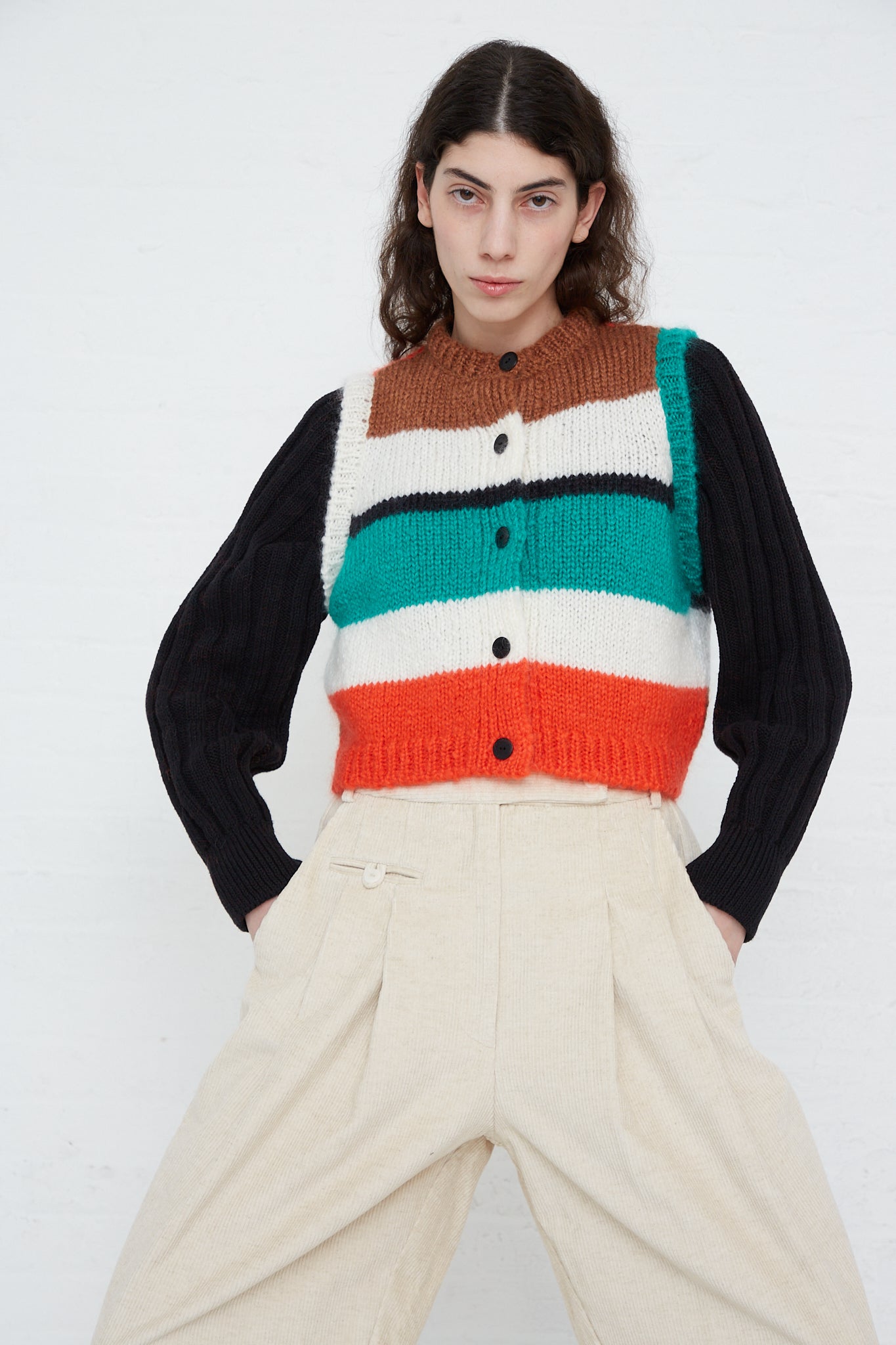 A model wearing a Mohair Waistcoat in Striped and pants. Front view.