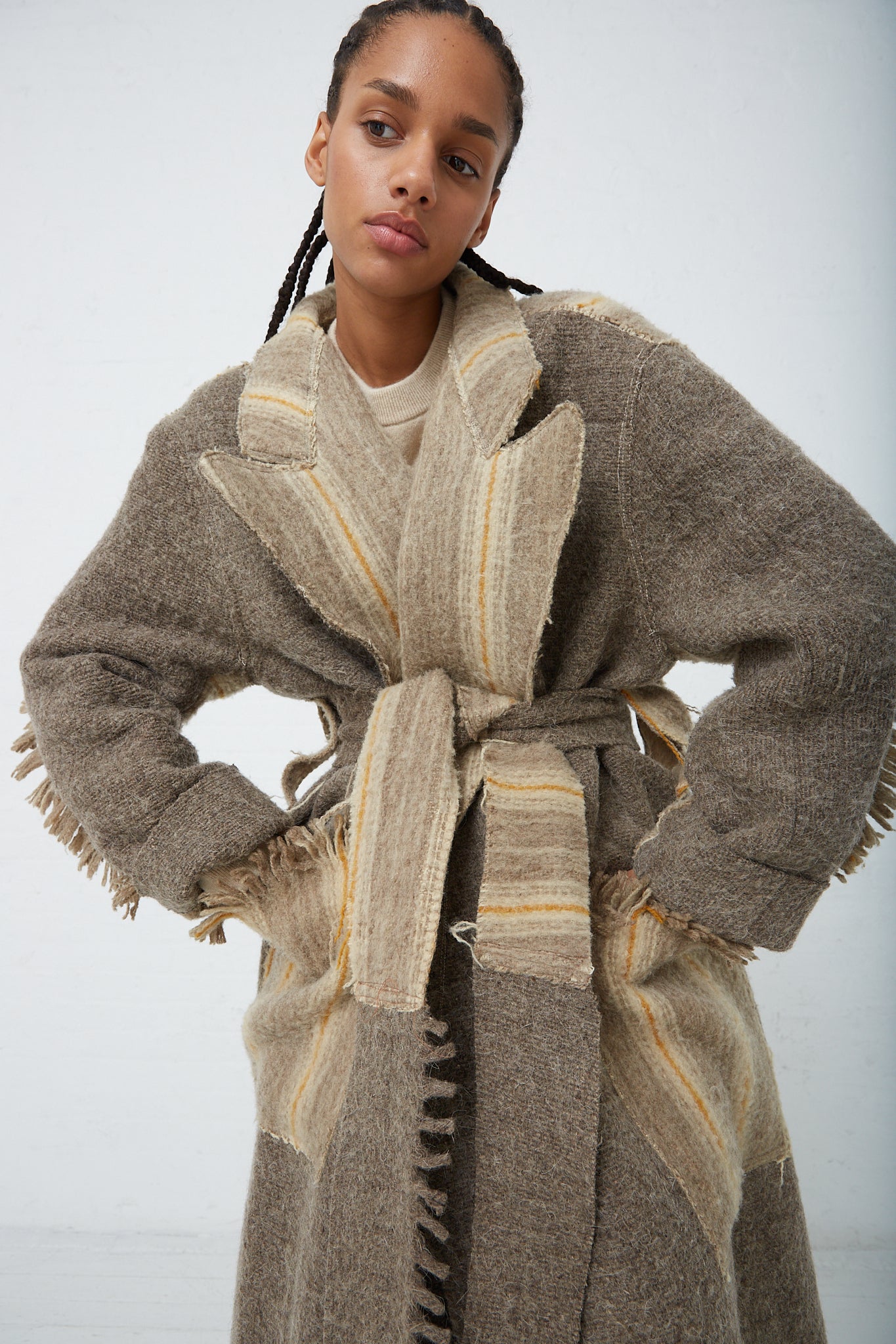 A woman wearing a Thank You Have A Good Day Wool Blanket Swing Trench.