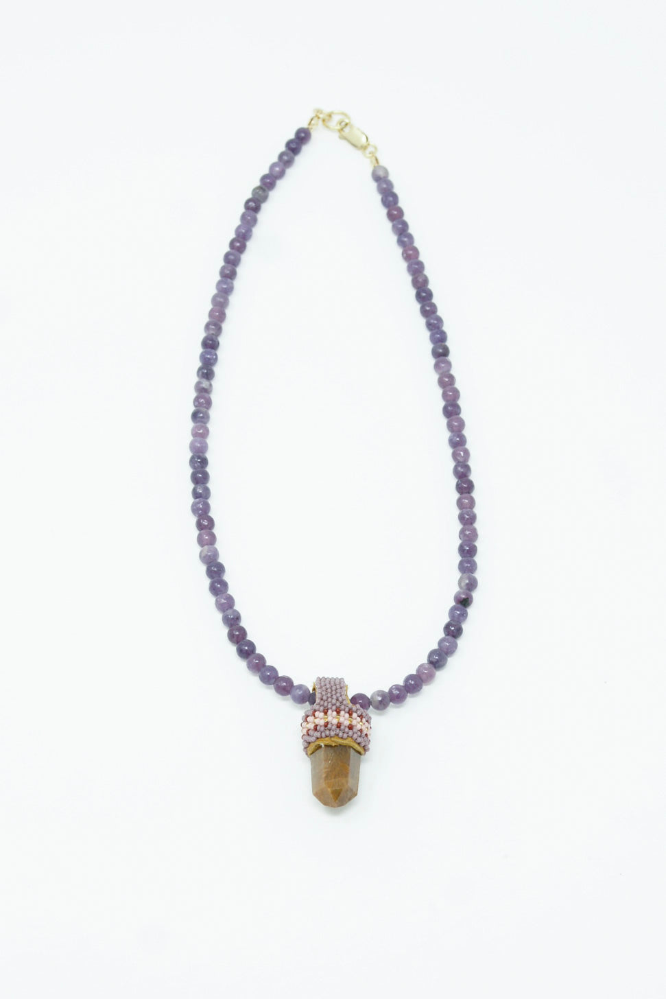 A Pendulum Necklace in Lepidolite Purple Beads, Rutilated Quartz Crystal pendant by Robin Mollicone.