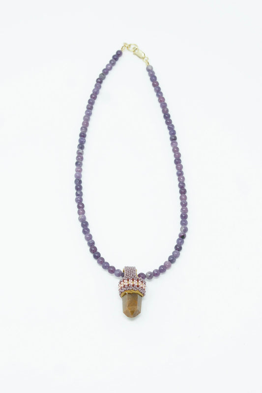 A Pendulum Necklace in Lepidolite Purple Beads, Rutilated Quartz Crystal pendant by Robin Mollicone.