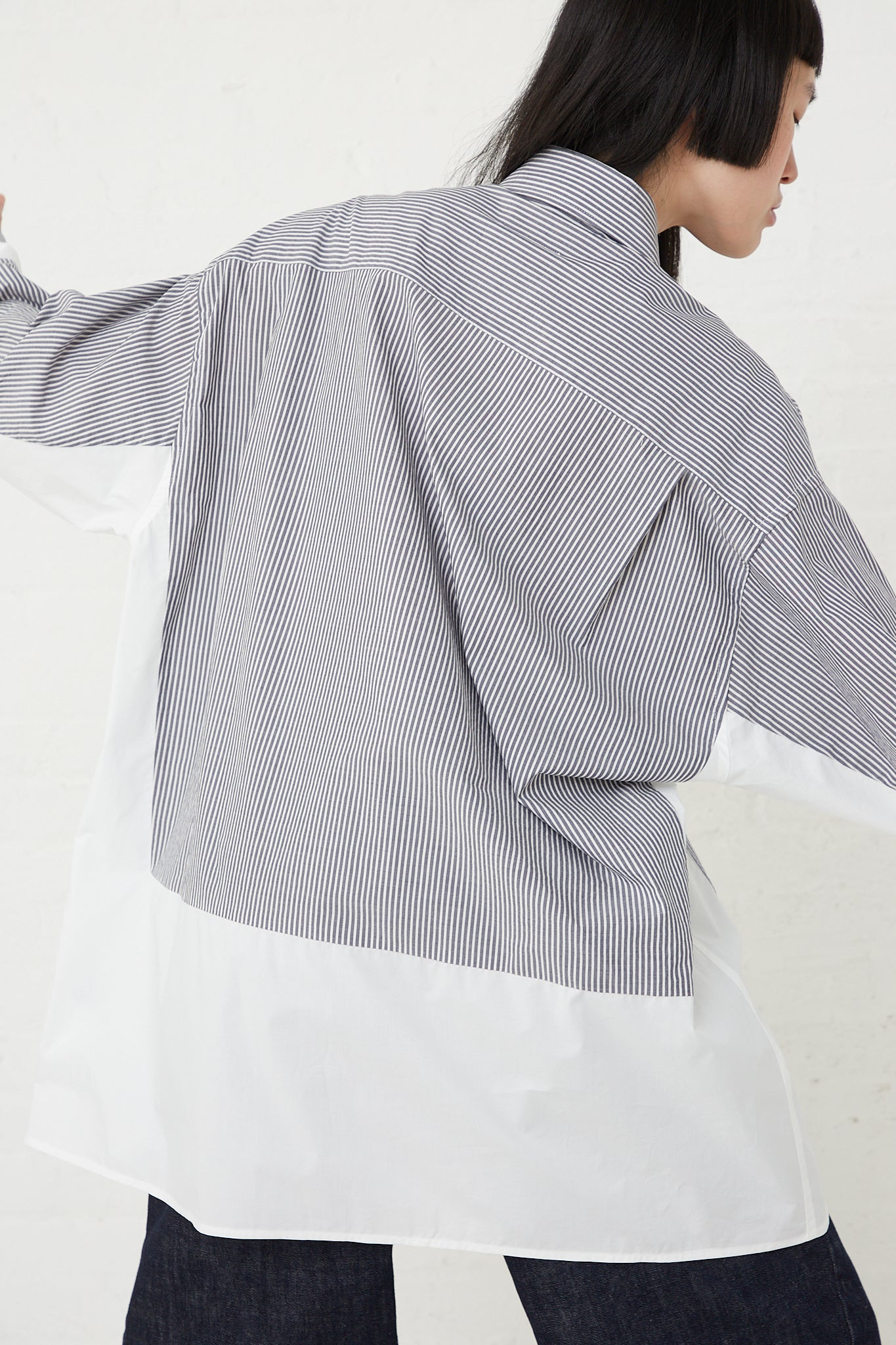 A woman's MM6 oversized fit, striped cotton shirt with a button-front.