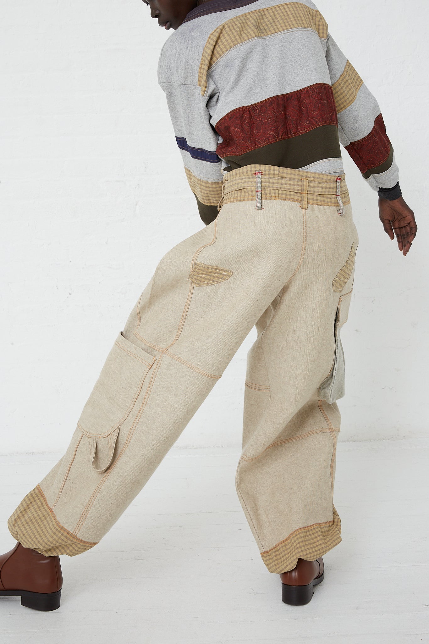 A model wearing SC103 Check Cotton Jupiter Pant in Tent with an oversized fit sweater. Available at Oroboro Store.