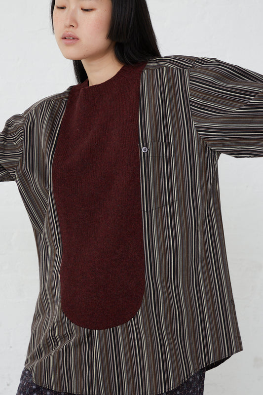 A woman wearing a Bless No. 68 Front Insert Pullover in Stripe.