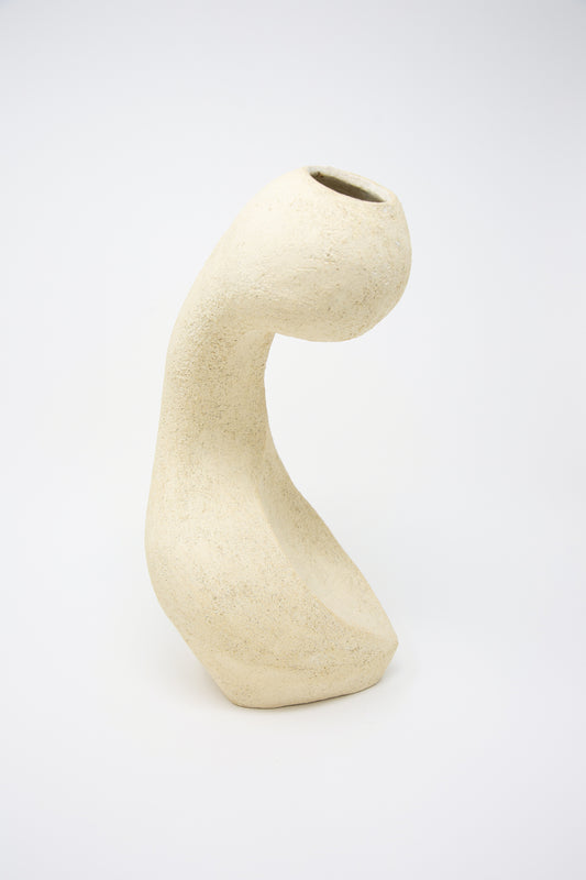 A Lost Quarry Large Hand Built Vessel No. 000711 Bud Vase, with its curved shape, is perfect for floral arrangements.