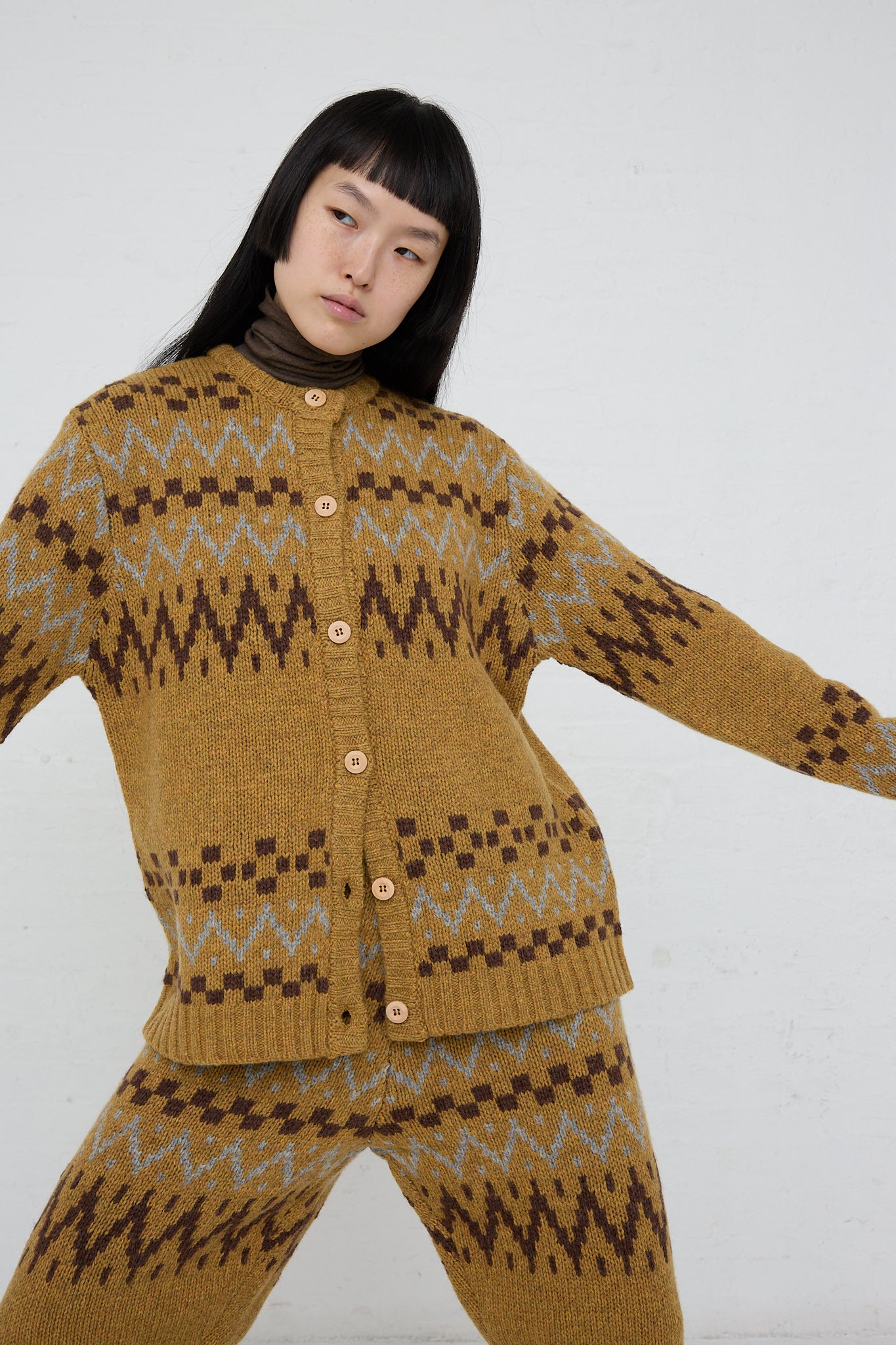 A model wearing an Ichi Wool Knit Cardigan in Camel. Full length front view. 