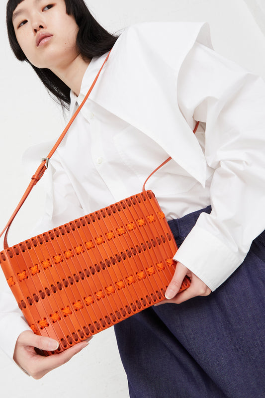 Hatori - Shoulder Bag 60 in Clementine:Tangerine:Spice full front view on model.