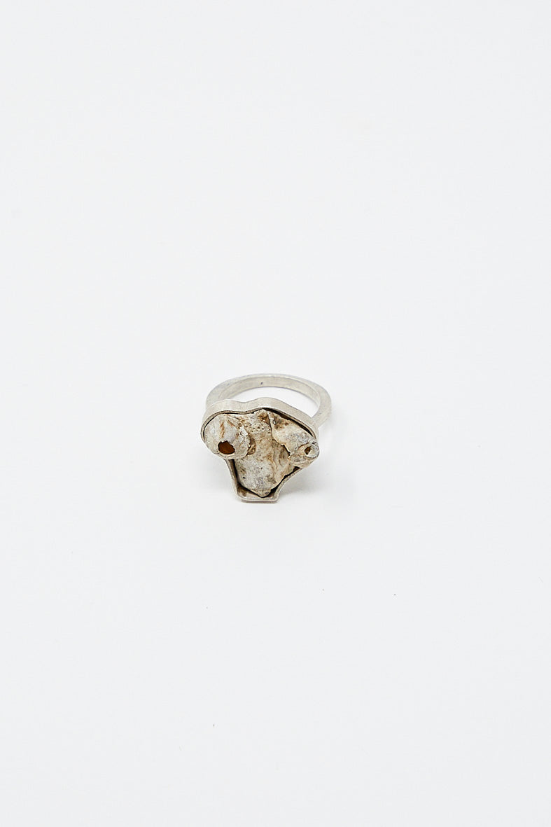 A La Ma r sterling silver ring 003 A with a stone in the middle, crafted using square wire.