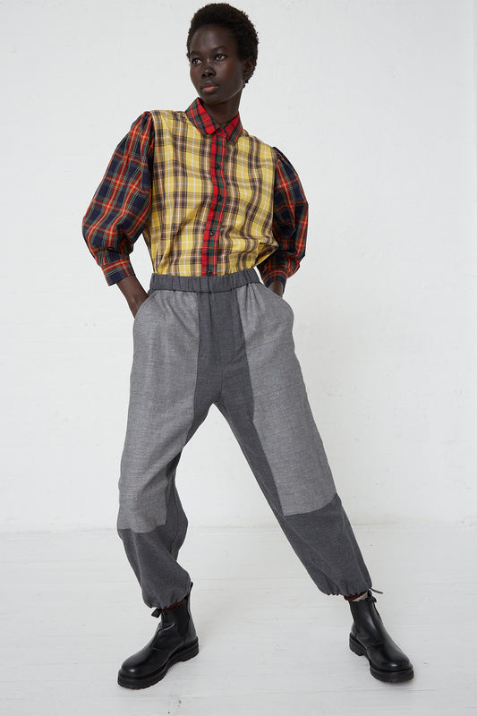 A woman in a plaid shirt with Japanese flannel and Cotton Linen Flannel Front Patch Pant in Gray from KasMaria.