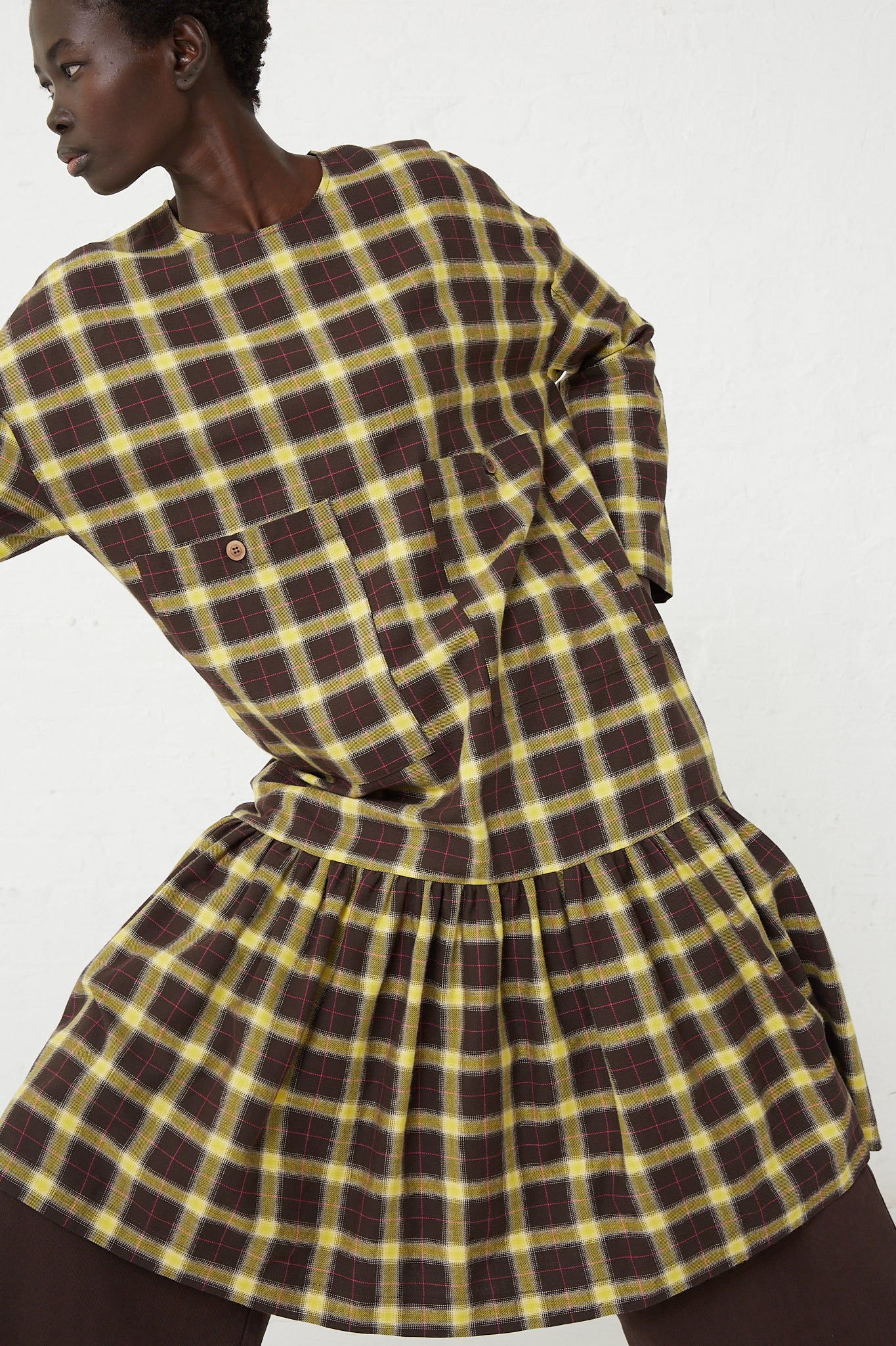 An oversized patch pocket midi dress in a yellow and brown plaid check cotton fabric called the Fun Dress in Check Brown, Yellow and Pink by AVN.