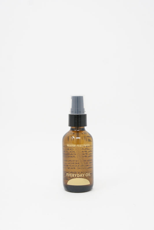 A small bottle of Everyday Oil Warm Feelings - 2 oz by Everyday Oil on a white background.