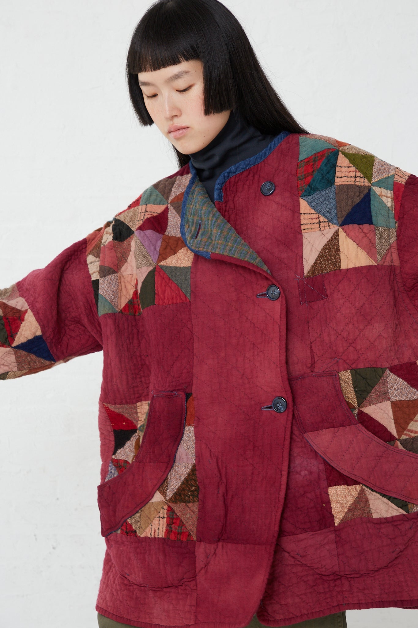 A woman wearing an oversized fit As Ever Quilt Jacket in Mulberry.