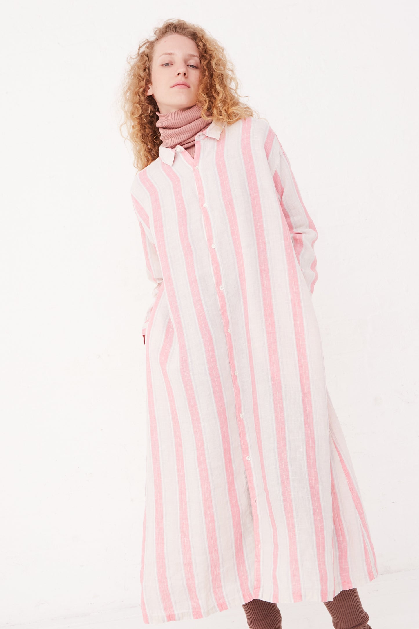 A model wearing a Linen Stripe Dress in Pink by Ichi Antiquités.