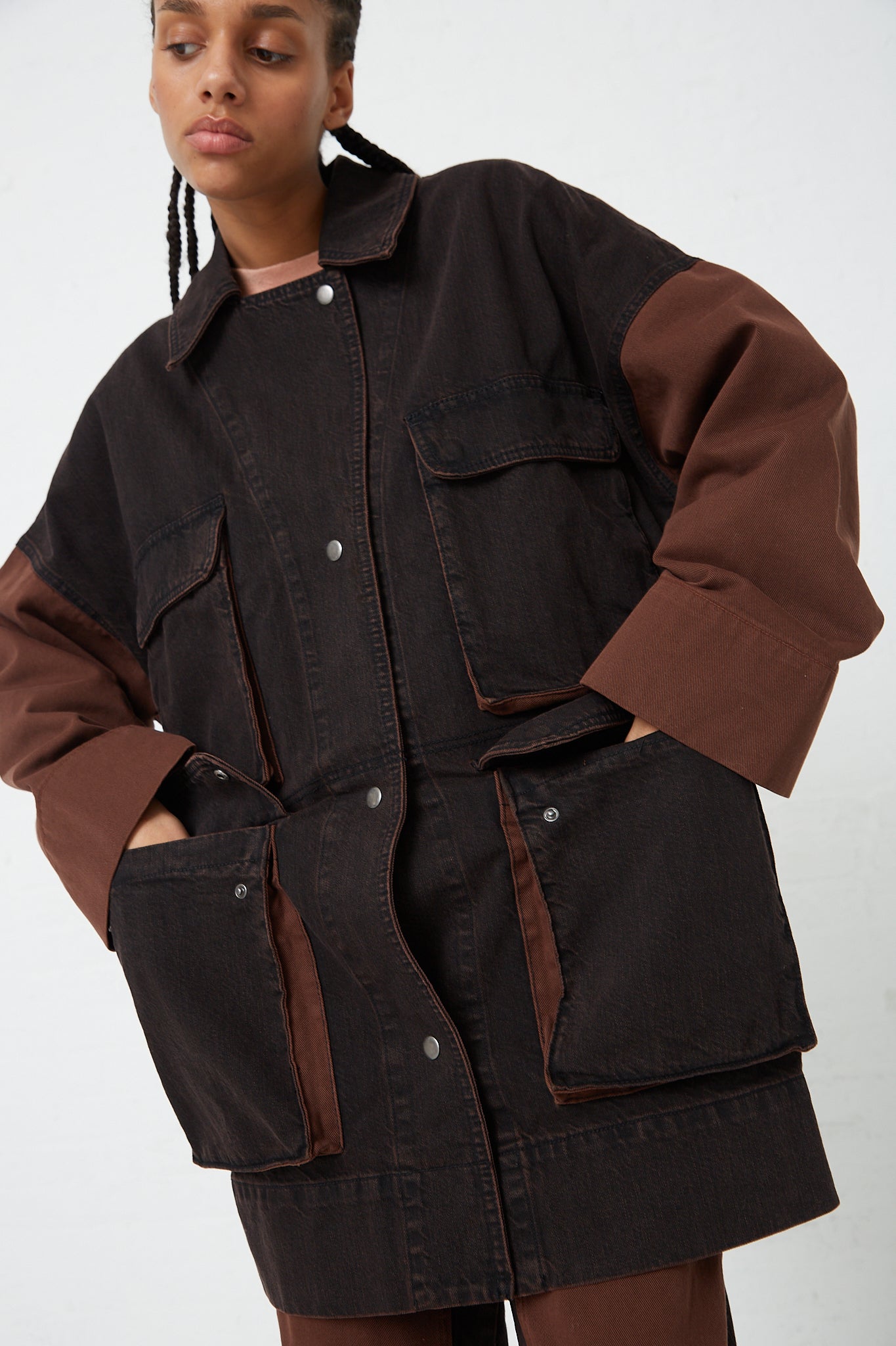 The model is wearing a Denim Celeiro Jacket in Chestnut by Rachel Comey.
