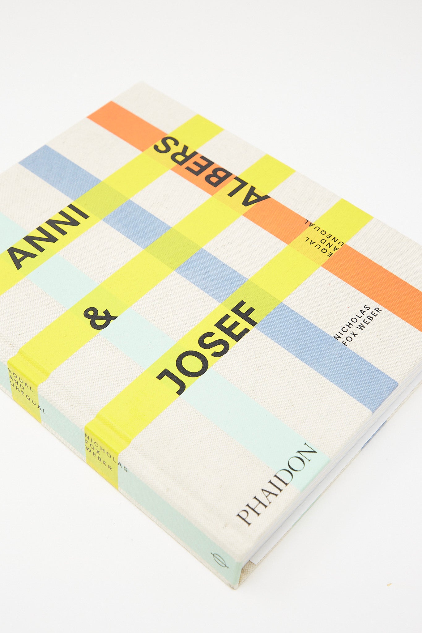 A hardcover book with the words Anni & Josef Albers: Equal and Unequal featuring Josef Albers and Anni Albers, published by Phaidon.