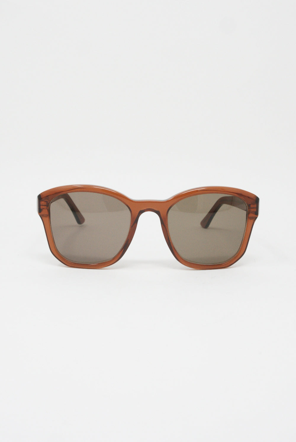 Handmade brown BQE Sunglasses in Judith by Eva Masaki, featuring a BQE frame, crafted from premium cellulose acetate material, beautifully showcased on a pristine white background.