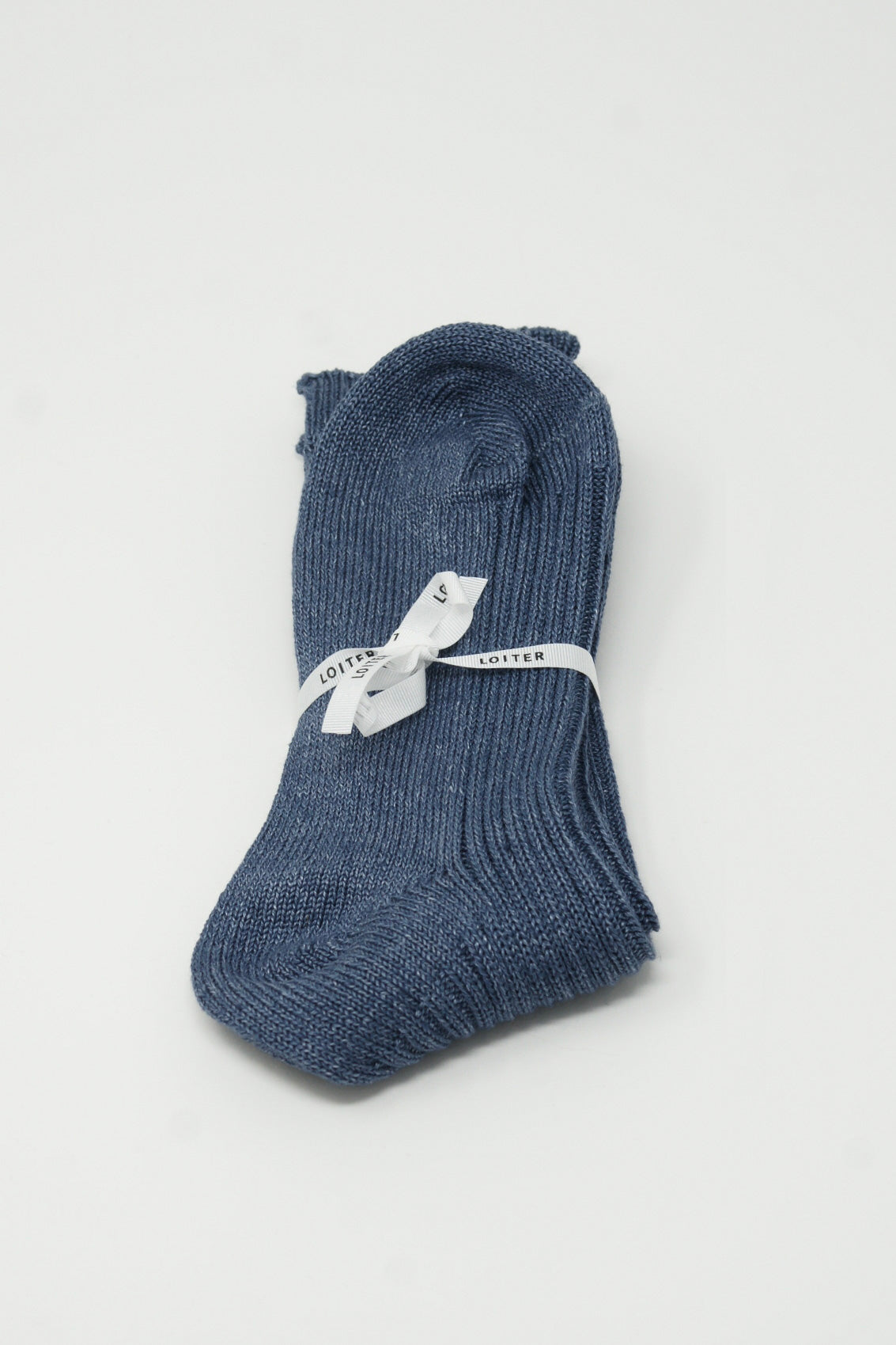 A pair of Linen Rib Socks in Blue by Ichi Antiquités on a white surface.