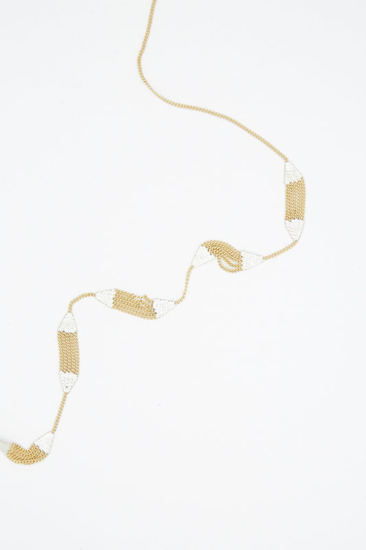 A Minnow Necklace in Brass Chain and Silver Solder handmade in California by Hannah Keefe.