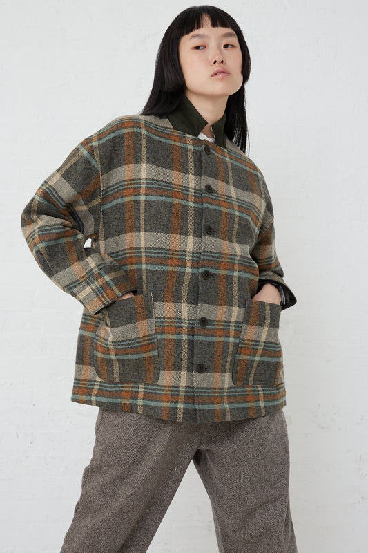 An oversized woman's Cotton Heavy Twill Plaid Shirt Jacket in Khaki and trousers from nest Robe.