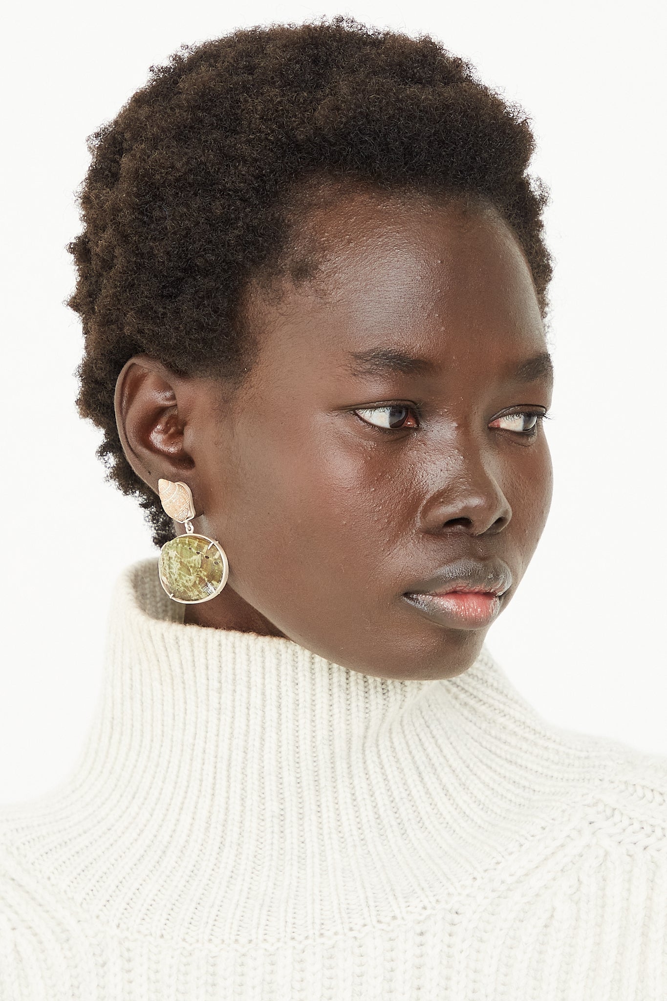 A model wearing La Mar brand Sterling Silver Shell Earrings 010.