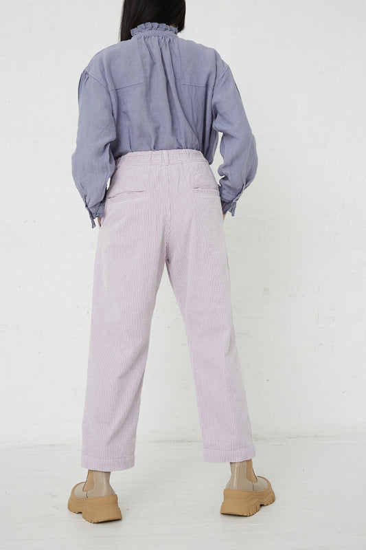 The back view of a woman wearing nest Robe's Cotton Corduroy Easy Pant in Lavender. Available at Oroboro store.