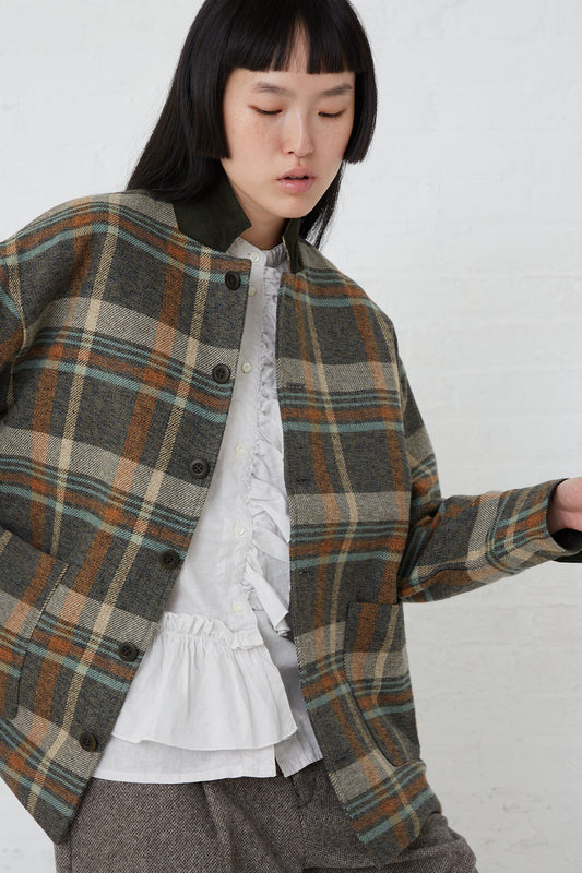 A model wearing a Cotton Heavy Twill Plaid Jacket in Khaki made by nest Robe.