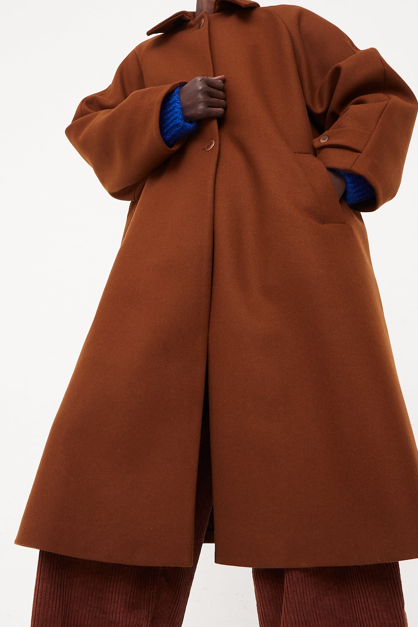 CORDERA Wool Coat Camel | Oroboro Store | Front image of coat upclose buttoned closed on model