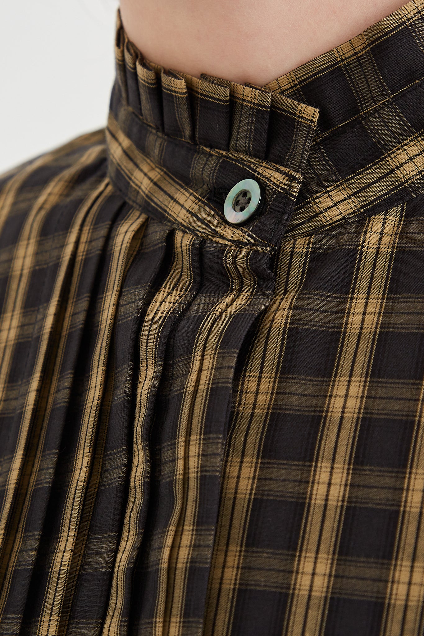 CHIMALA Pleated Stand Collar Shirt in Yellow Check - Oroboro Store | Front view and up close showcasing button detail on collar.